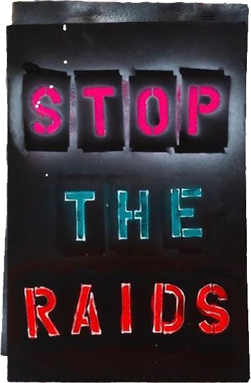 STOP THE RAIDS Spray paint art from Stop the raids Las Vegas 2024